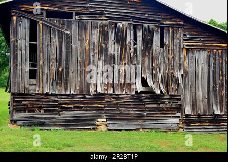Warped boards on an old barn Stock Photo