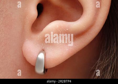 Woman with dry skin, closeup of ear Stock Photo