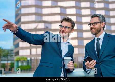 Motivation and inspiration for the two business man. Two business men discussed their strategy. The partnership between the two business men was succe Stock Photo