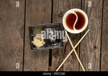 food container for delivery of sushi soy sauce and wasabi with food, delivery from sushi restaurant Stock Photo