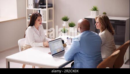 Young Woman Sitting At Interview In Office Stock Photo