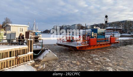 Turku, Finland - January 22, 2016: City boat Fori with passengers is on the way. This is a light traffic ferry that has served the Aura River for over Stock Photo