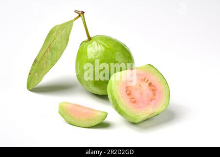 Pink guava fruits isolated on white background.Guava fruit with leaf isolated on white background.Thai Pink guava fruits isolated on white background. Stock Photo