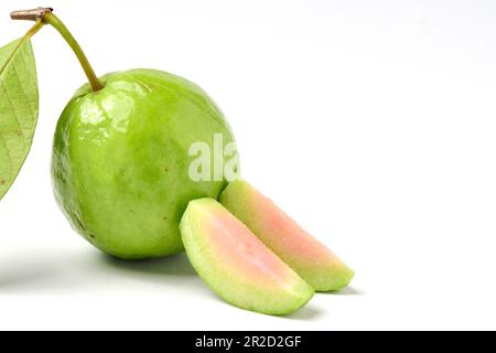 Pink guava fruits isolated on white background.Guava fruit with leaf isolated on white background.Thai Pink guava fruits isolated on white background. Stock Photo