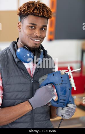 male engineer controlling process of cutting steel Stock Photo
