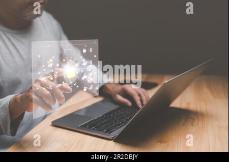 Businessman working from home using laptop with virtual screen. Process data and manage files on Internet efficiently. Online document database system Stock Photo