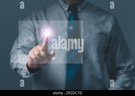 Cybersecurity and privacy concepts to protect data. Businessman touching to sign in for protecting personal data with virtual screen interfaces. login Stock Photo