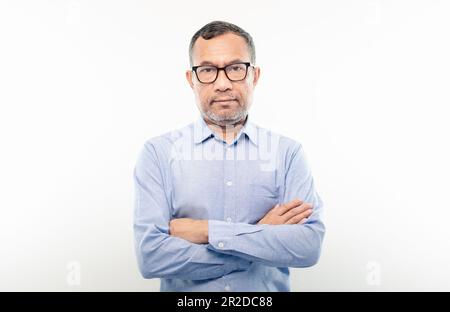 40-50 years old Asian businessman look at camera and folded his arms and smiled happily after successfully investing in finance, banking, real estate. Stock Photo