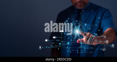 Businessman touching to sign in for protecting personal data with virtual screen interfaces. Cybersecurity and privacy concepts to protect data. Lock Stock Photo