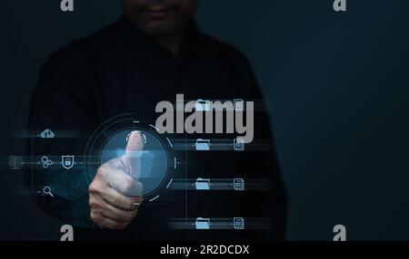 Businessman touch id to using technology with virtual screen. Process data and manage files on Internet efficiently. Online document database system a Stock Photo