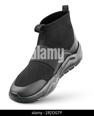 Black high-top sneaker without shoelaces stands on the tip isolated on white background. Running sports shoe with clipping path. Full Depth of Field Stock Photo