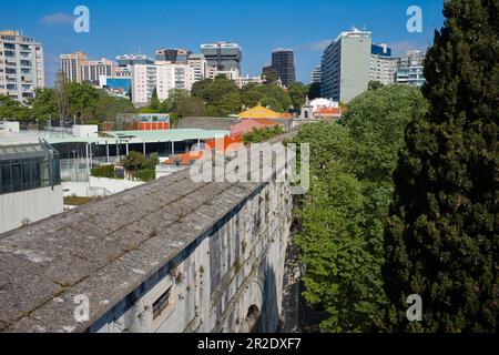 Looking along the aqueduct at Amoreiris, Lisbon with high rise apartments behind Stock Photo