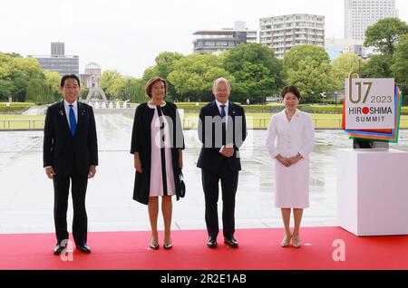 German Chancellor Olaf Scholz (2nd R) and his wife Britta Ernst (2nd L) are welcomed by Japan's Prime Minister Fumio Kishida (L) and First Lady Yuko Kishida at the Peace Memorial Park as part of the G7 Leaders' Summit in Hiroshima on Friday, May 19, 2023 in Hiroshima, Japan. The members of the G7 - US, Canada, France, Germany, Japan, the United Kingdom and Italy meet in the Japanese city of Hiroshima on Thursday for an annual summit. The leaders talk will focus on Russia's war on Ukraine, China's rising power and influence, nuclear disarmament, artificial intelligence, climate change and econo Stock Photo