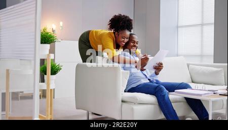 Letter Young Family Couple Reading Good News Paper Stock Photo