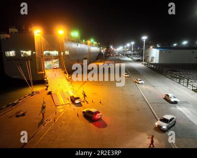 LIANYUNGANG, CHINA - MAY 19, 2023 - Ro-ro wheels load 1,700 cars for export to Mexico at Berth 58 of Lianyungang Terminal in East China's Jiangsu prov Stock Photo