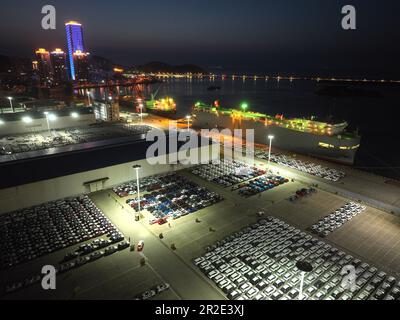 LIANYUNGANG, CHINA - MAY 19, 2023 - Ro-ro wheels load 1,700 cars for export to Mexico at Berth 58 of Lianyungang Terminal in East China's Jiangsu prov Stock Photo