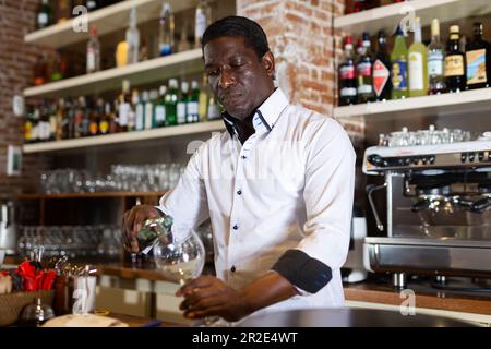 Bartender pouring a drink Stock Photo