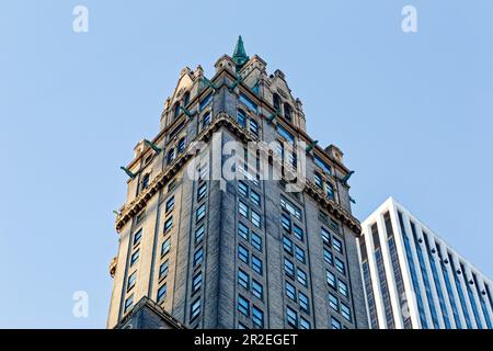 Looking up at the Sherry-Netherland's gargoyle-studded neo-Romanesque crown. The General Motors Building stands behind. Stock Photo