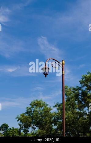 Old vintage street lamp on the street during sunny day again beautiful blue sky,Old vintage street lamp Stock Photo