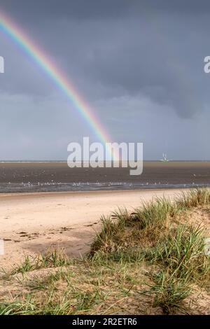 Rainbow over sailing ship in the Wadden Sea, Schillig, Wangerland, Friesland, Lower Saxony, Germany, Europe Stock Photo