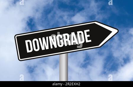 Downgrade road sign on sky background Stock Photo