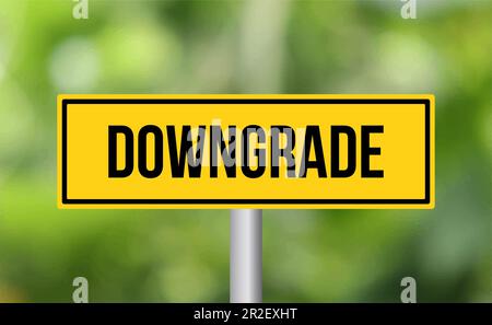 Downgrade road sign on blur background Stock Photo