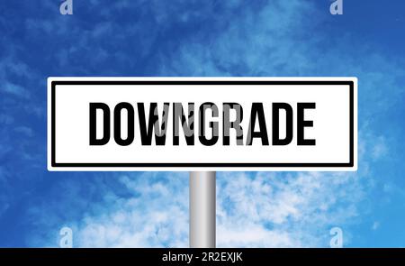 Downgrade road sign on sky background Stock Photo