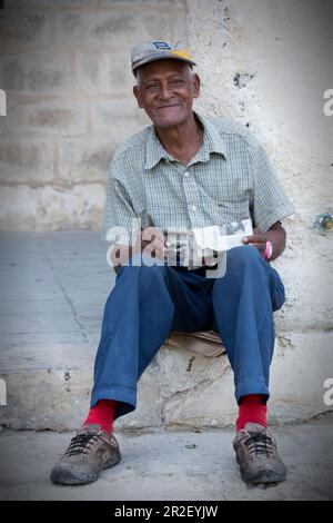 Portrait of an older Cuban man at Plaza de la Catedral, Havana, Cuba Stock Photo