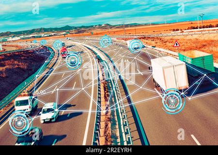 Car and trucks driving on a highway with technology assistant tracking information.Autonomous car. Driverless car. Self driving vehicle. Stock Photo