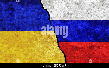 Ukraine and Russia flag on wall with crack. Concept of conflict between Russia and Ukraine Stock Photo