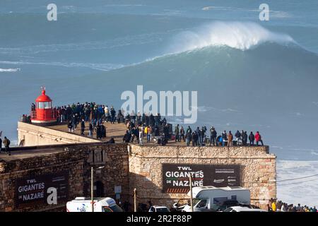 Europe, Portugal, Oeste Region, Nazaré, Crowd watching the Huge Waves from Forte de Sao Miguel Arcanjo during Free Surfing Event 2022 Stock Photo