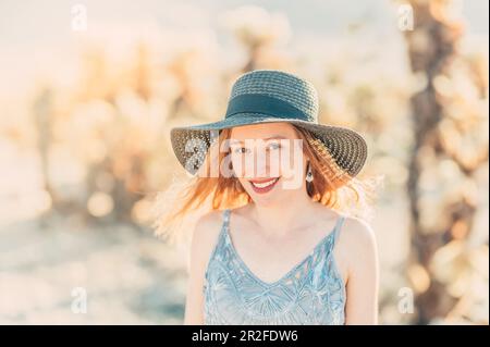 Woman with sun hat in Cholla Cactus Garden, Joshua Tree National Park, California, USA, North America Stock Photo