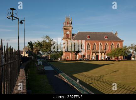 Bowls in play in front of the Wigtown County Buildings and Town Hall at the Wigtown lawn bowling club green in Wigtown; Dumfries; and Galloway, Scotla Stock Photo