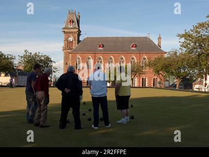 Bowls in play in front of the Wigtown County Buildings and Town Hall at the Wigtown lawn bowling club green in Wigtown; Dumfries; and Galloway, Scotla Stock Photo