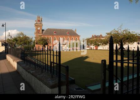 Bowls in play in front of the Wigtown County Buildings and Town Hall at the Wigtown lawn bowling club green in Wigtown; Dumfries; and Galloway, Scotla Stock Photo