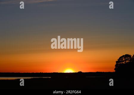 Sunset in intense bright colors at Hornborgasjön, Sweden Stock Photo