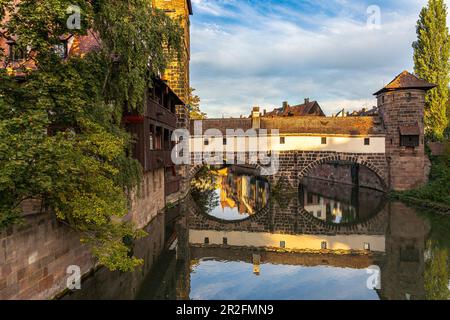 View from Maxbrücke to the Pegnitz (river) and the Henker's Bridge in the evening light, Nuremberg city center, Franconia, Bavaria, Germany Stock Photo