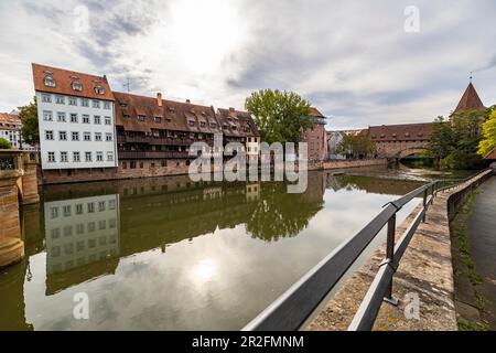 View from Maxbrücke to the Pegnitz (river) with historic house facades in the afternoon, Nuremberg city center, Franconia, Bavaria, Germany Stock Photo