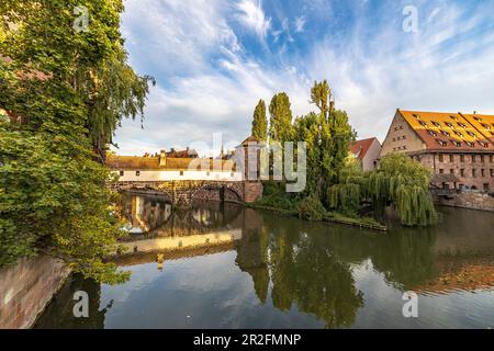 View from Maxbrücke to the Pegnitz (river) and the Henker's Bridge in the evening light, Nuremberg city center, Franconia, Bavaria, Germany Stock Photo