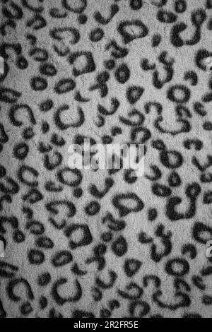 Soft fleecy faux fabric with a mottled pattern. Light leopard texture. Stock Photo