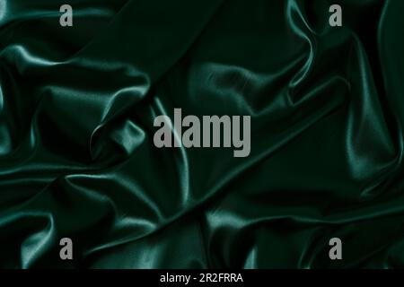 Silk fabric, abstract wavy green satin fabric background Stock Photo