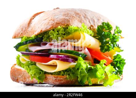Sandwich with cheese and ham and fresh vegetables isolated on white Stock Photo
