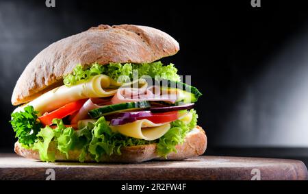 Sandwich with cheese and ham and fresh vegetables Stock Photo