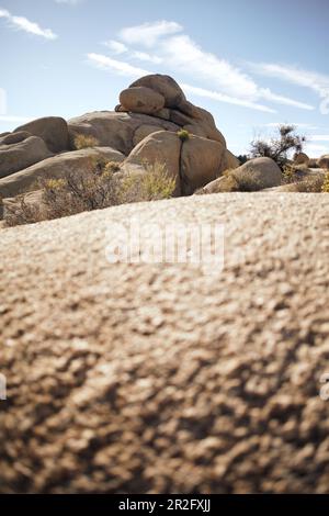 View over a rock to another rock formation in the Jumbo Rocks in Joshua Tree Park, California, USA. Stock Photo