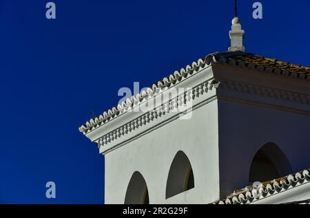 Moorish style house with white facade against a deep blue sky, Ronda, Andalusia, Spain Stock Photo