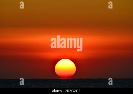 Dramatic sunrise over the Mediterranean Sea, Sant Feliu de Guixols, Catalonia, Spain Stock Photo