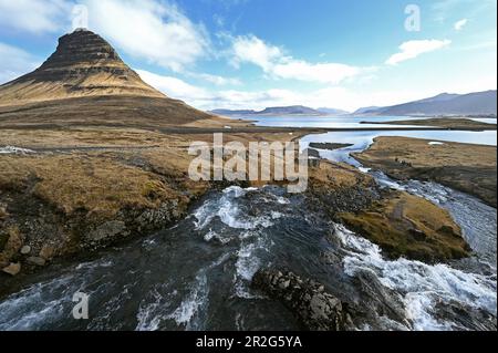 Kirkjufellsfoss waterfall and Kirkjufell mountain on the north coast of the Snaefellsnes peninsula in western Iceland Stock Photo