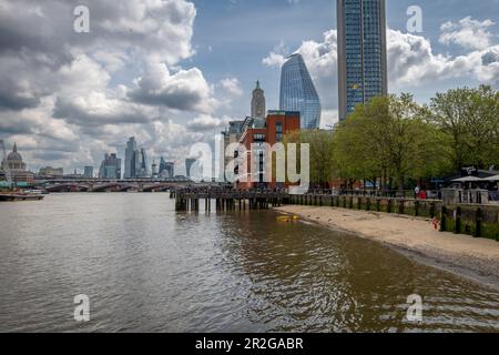 London. UK- 05.17.2023. General view of the Thames Beach. A sandy beach on the south bank of the River Thames. Stock Photo