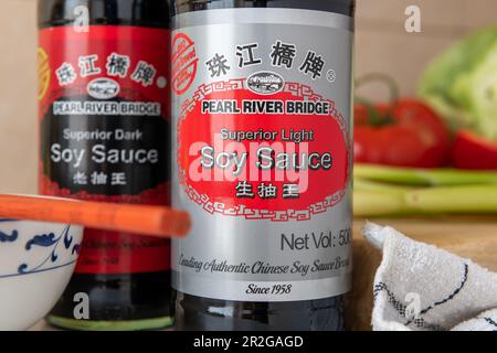 London. UK- 05.14.2023. Close up of a bottle of light and dark Pearl River Bridge soy sauce. Stock Photo