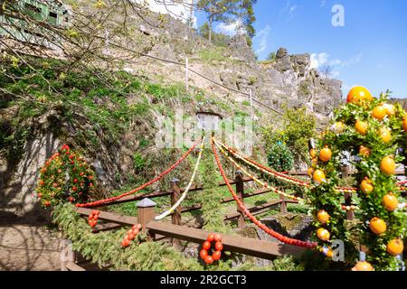 Easter spring decorated with colorful Easter eggs at the Trubachquelle in Obertrubach in Franconian Switzerland, Bavaria, Germany Stock Photo